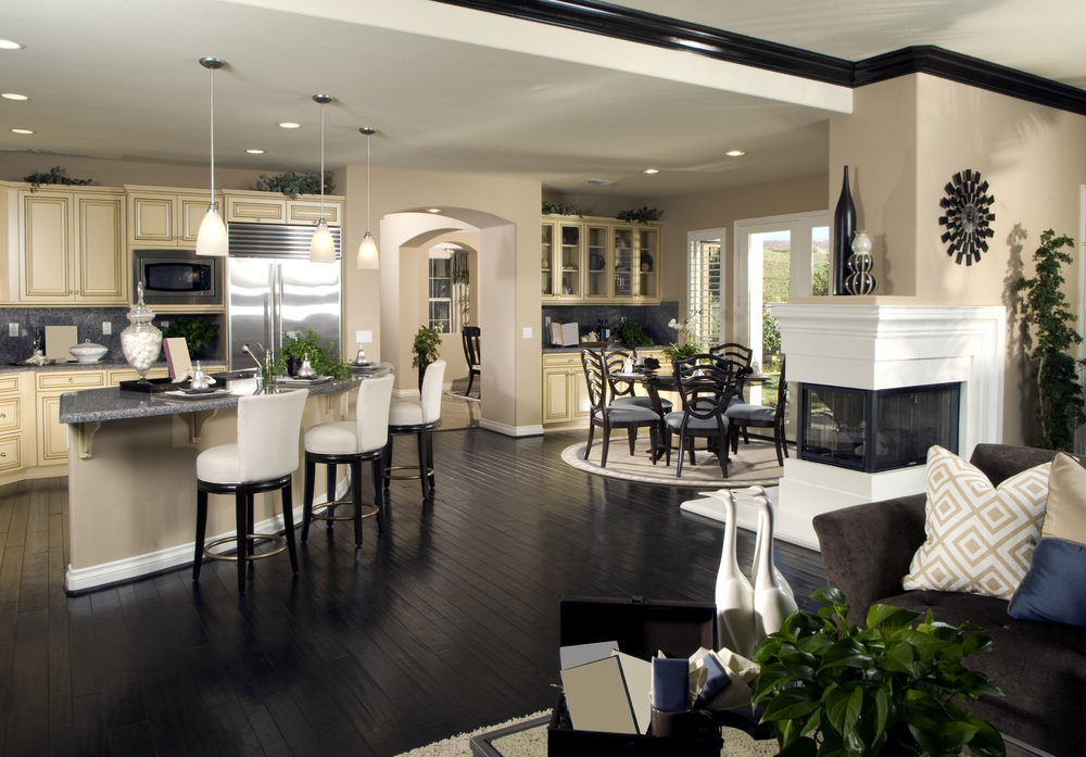 black-wood-floor-feats-leather-bar-stools-in-stunning-open-concept-kitchen-living-room-design-plus-elegant-corner-fireplace