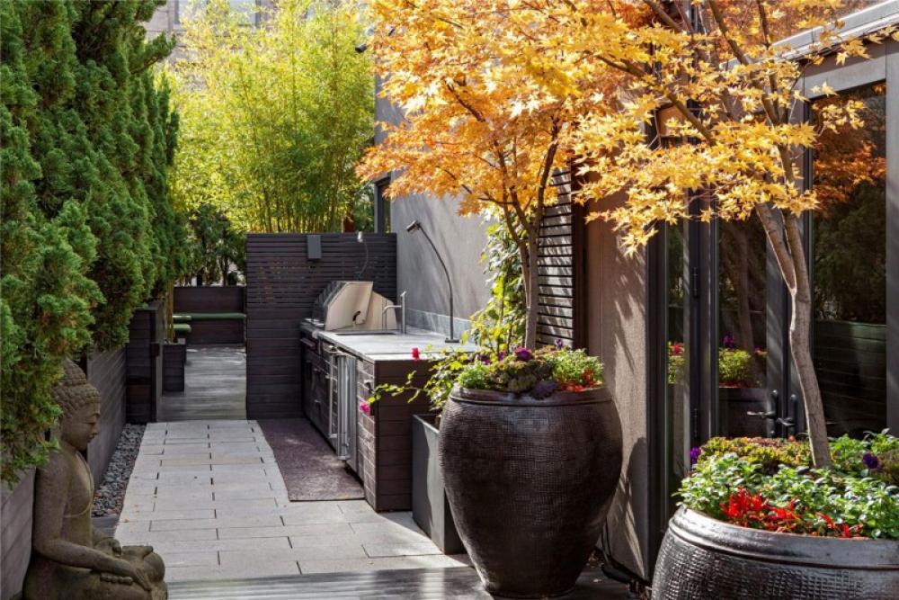 Asian Statue With Oversized Planters In Minimalist Outdoor