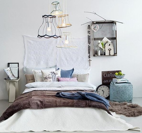 Eclectic bedroom with pendant lights