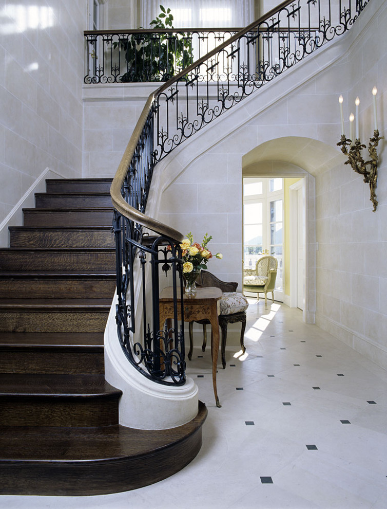 Fabulous-Stair-Railing-decorating-ideas-for-Arresting-Entry-Traditional-design-ideas-with-arch-banister-console-table-entry-table-floor-tile-design-foyer-french-limestone