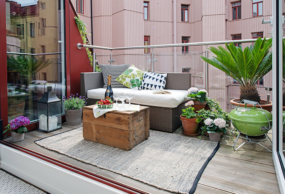 Urban-Apartment-with-Terrrace-charming-eclectic-terrace-with-outdoor-lounge-and-potted-plants