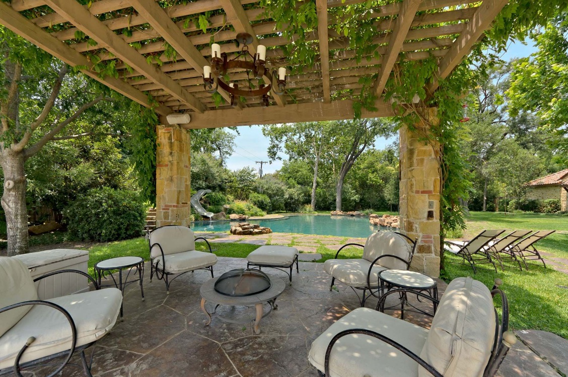 large-wooden-pergola-canopy-with-decorative-ivy-plants-plus-cream-outdoor-living-space-seating-area