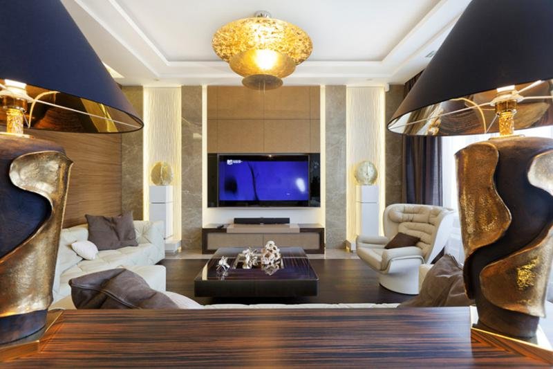 living-rooms-for-small-spaces-with-golden-lamp-in-the-roof-and-big-flat-tv-in-the-brown-wall-and-three-cream-sofa-one-bedroom-apartment-decorating-ideas-on-a-budget