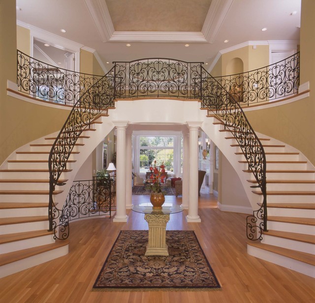 traditional-entry-hiring-dramatic-marble-elevations-columns-flower-arrangement-foyer-stairsentry