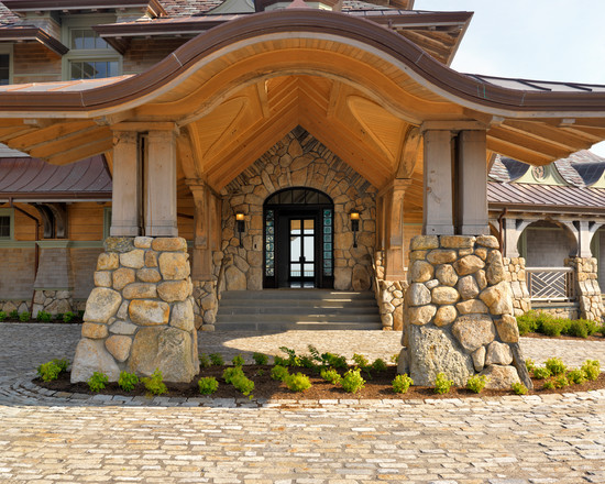 Charming-Traditional-Beach-Style-Entry-with-Exposed-Stone-Wall-Darkwood-Door-Design-Beach-Bay-Point-Exterior