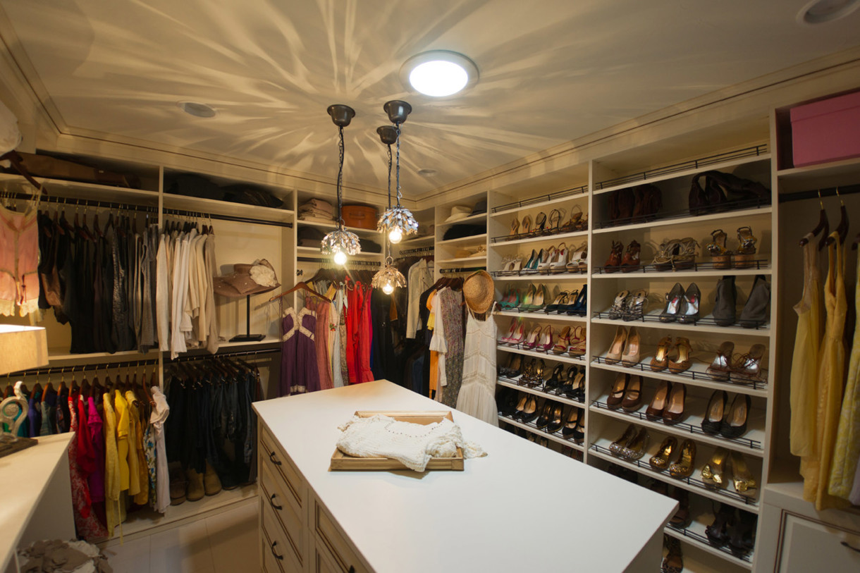 Classy-high-walk-in-closets-design-with-shoe-storage-and-cool-hanging-lamp-closet-shoe-storage-ideas