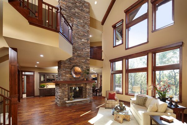 open-plan-living-room-with-stone-fireplace-high-ceiling-