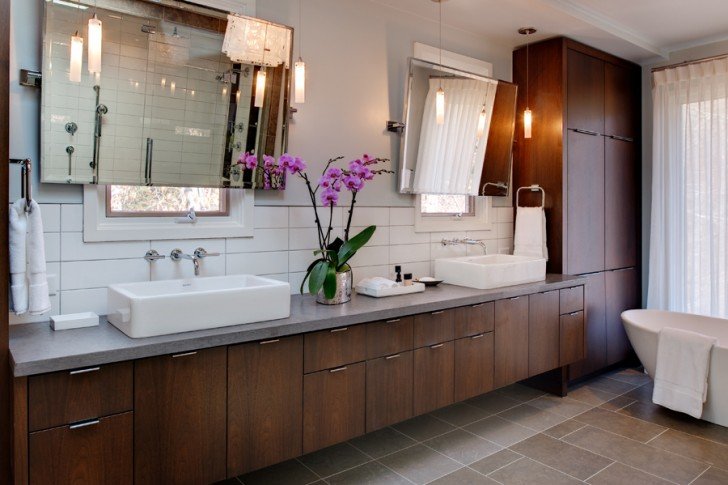 wondrous-mid-century-modern-bathroom-vanity-design-in-wooden-style-with-long-gray-countertop-with-mounted-sinks-beneath-frameless-wall-mirror-on-white-tile-backsplash-with-purple-orchid-728x485