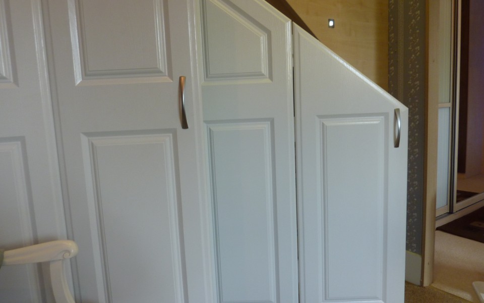 Cupboard-under-stairs-with-doors-open-