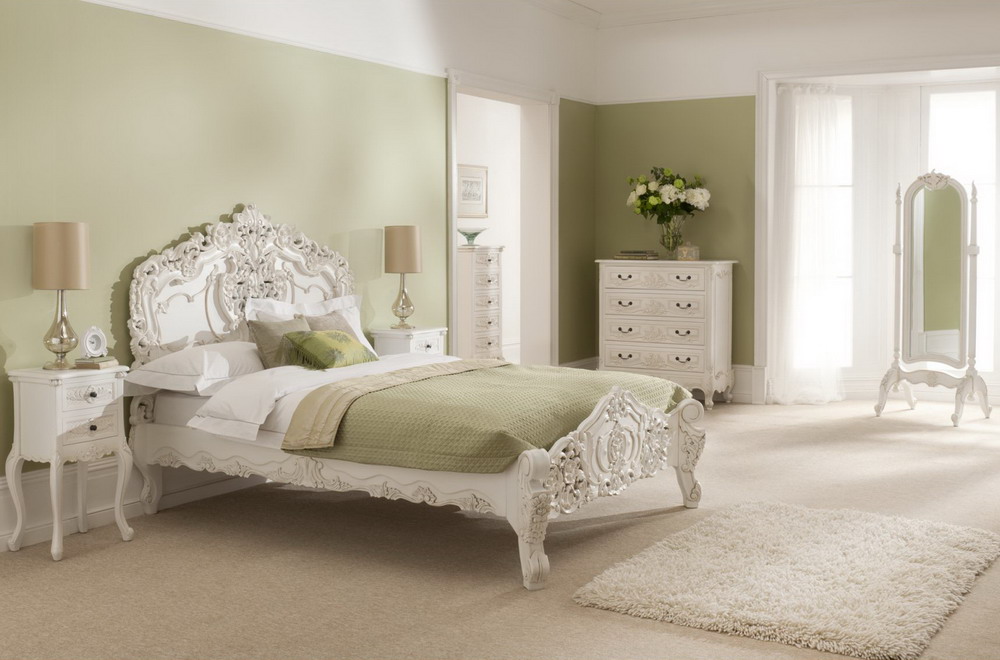 White-Furniture-Sets-In-A-French-Bedroom-Design-With-Area-Rug-And-Flower-Decoration