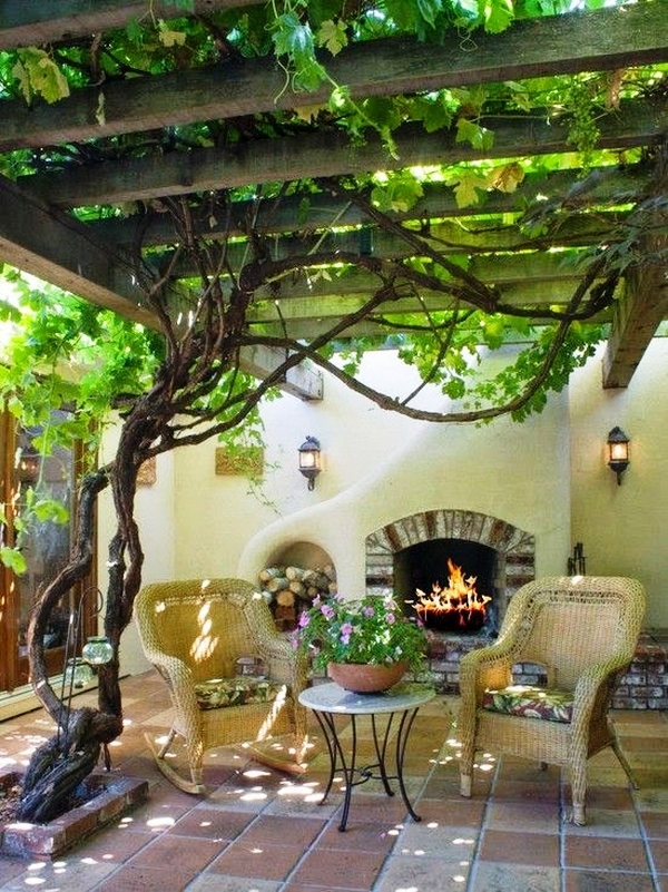 small-patio-ideas-fireplace-outdoor-furniture-wooden-pergola-grapevines