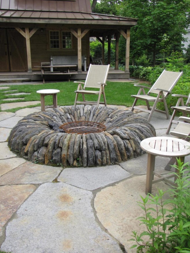 white-lounge-chairs-with-decorative-fire-pit-stone-design-filled-on-outdoor-classic-park-