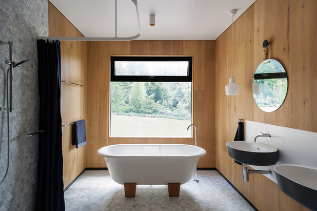 Contemporary bathroom with wooden wall covering.
