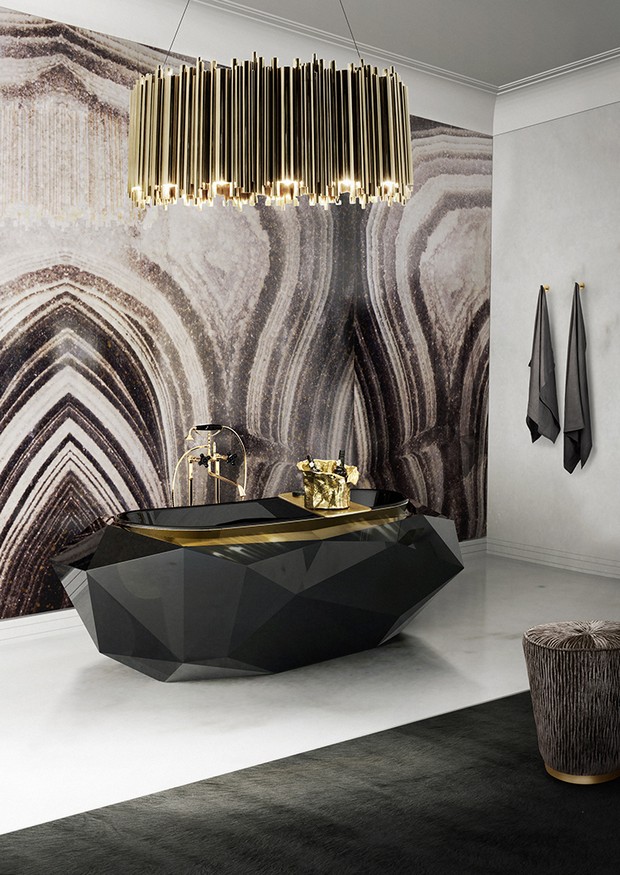 Luxury bathroom with gold and raw material combination.