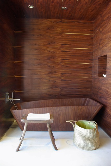dark veined wood theme bathroom design.