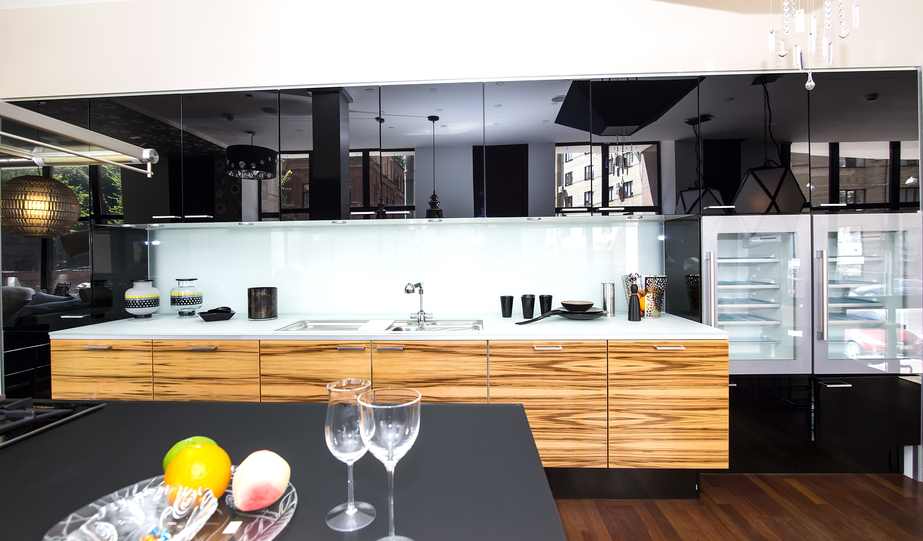 Luxury high end black and wood kitchen with top-of-the-line appliances