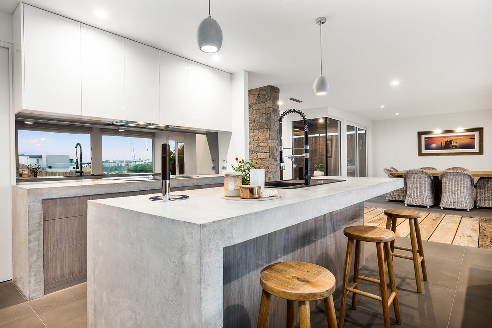 Timber Veneer Kitchen With Polished Concrete Tops